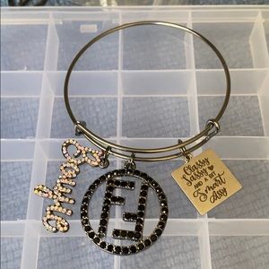 Black bangle with charms